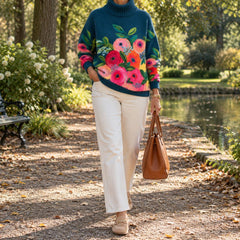 Woman walking in a park wearing the Alice sweater