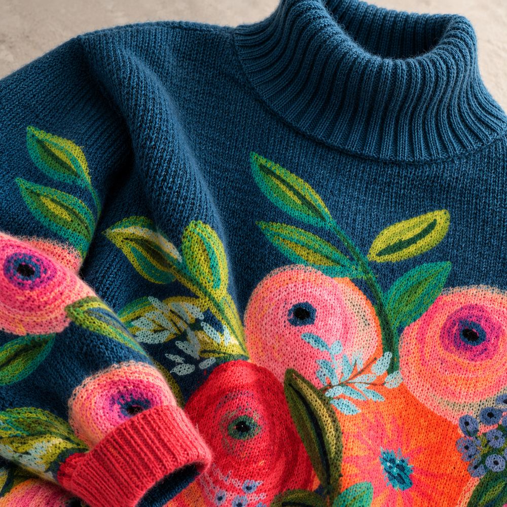 Close-up of the embroidered floral knit detail on the Alice sweater
